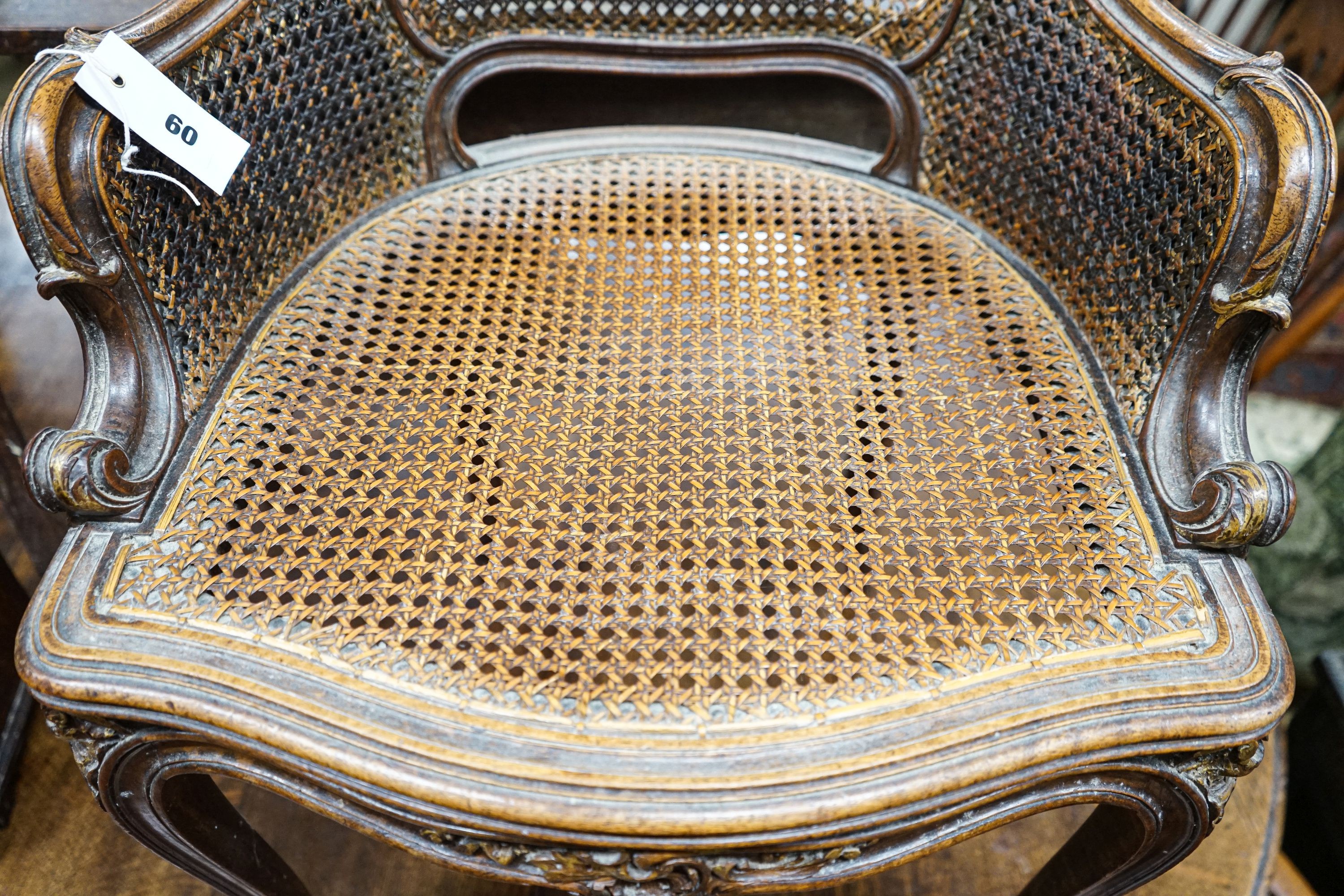 A 19th century French carved and caned walnut salon chair, width 52cm, depth 46cm, height 87cm